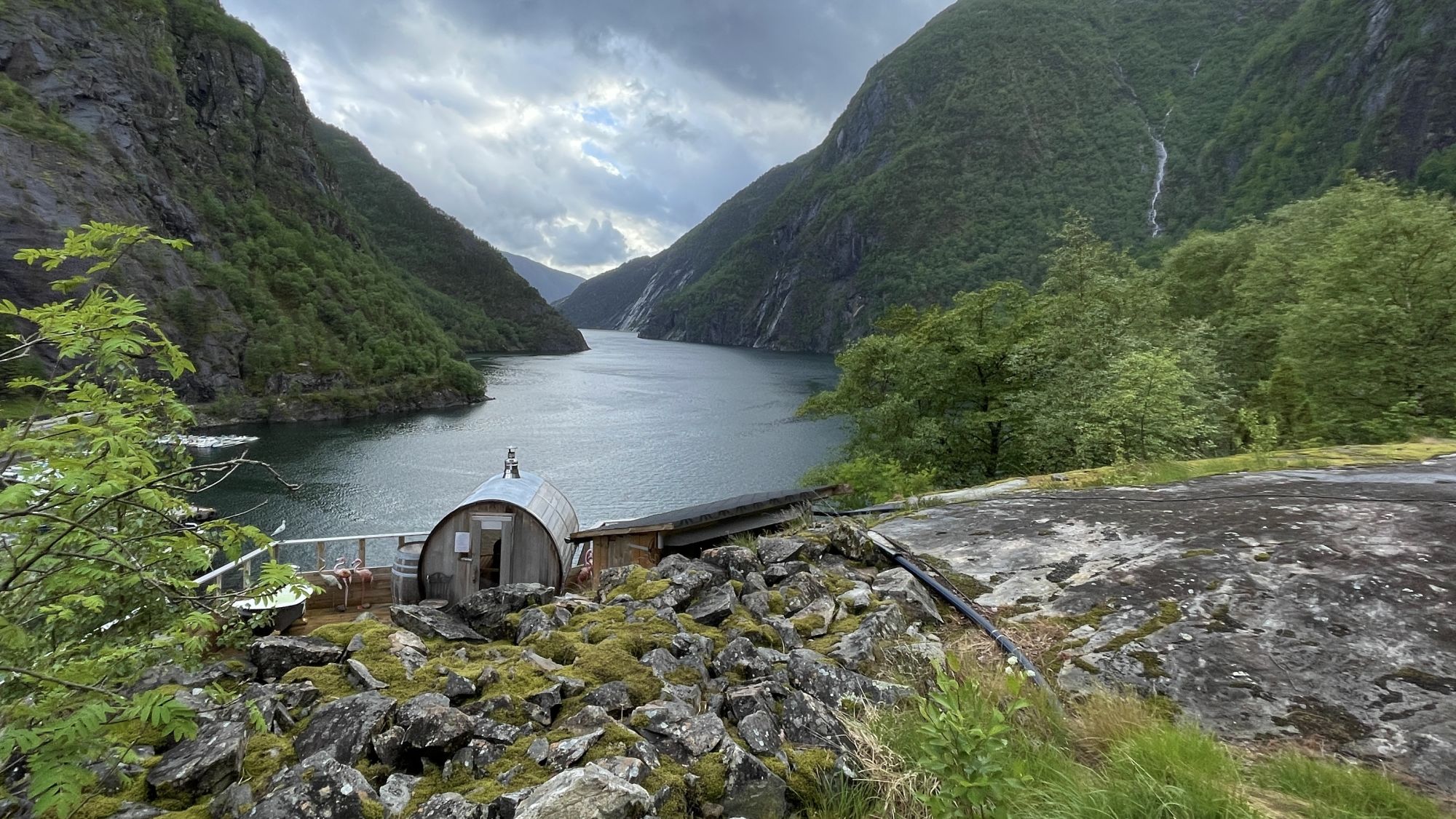Scenic Norwegian coastal road winding through fjord country on a clear day