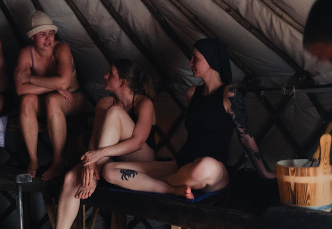 Arctic sauna near Kirkenes with snow-covered landscape and winter sky above the Barents Sea