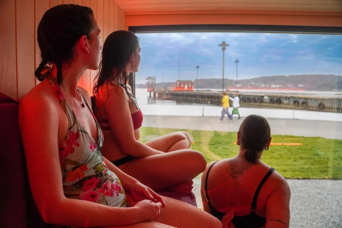 Waterfront sauna scene on the Larvik coast with calm sea and wooden deck