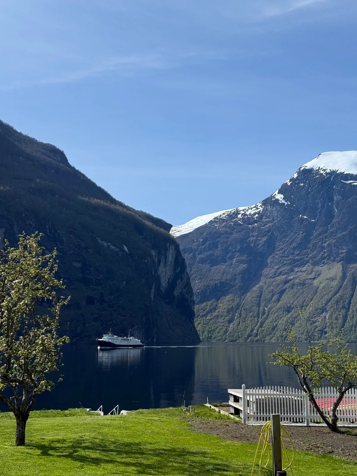 Geirangerfjord with the Seven Sisters waterfall cascading down steep green cliffs