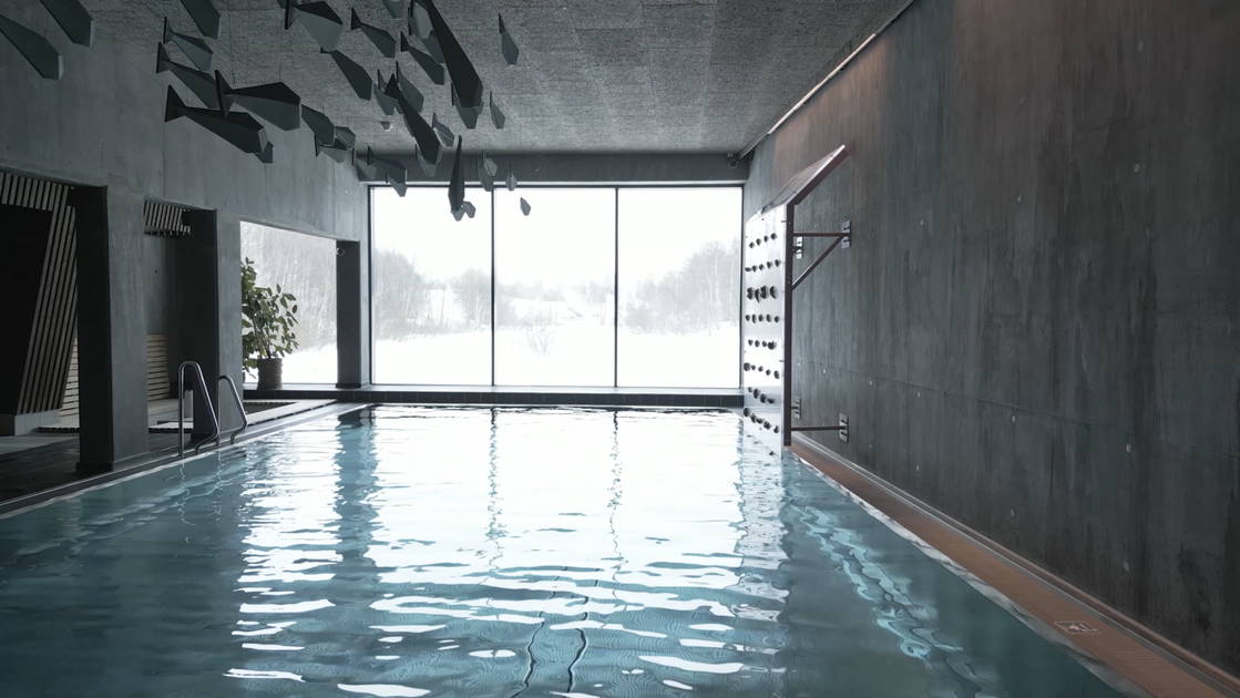 Snow-covered wooden buildings in the historic town of Røros at dusk