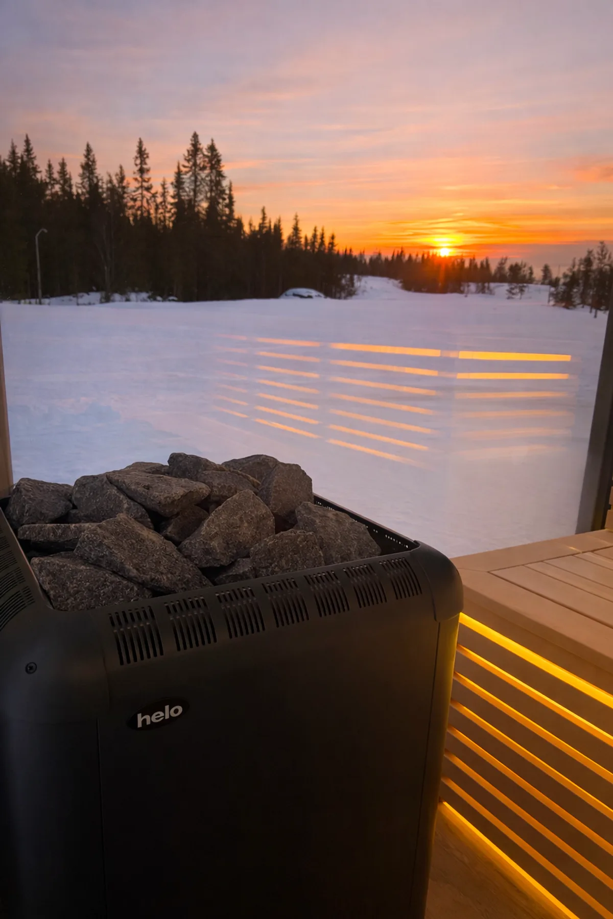 A snow-covered Norwegian mountain resort at dusk with warm cabin lights glowing